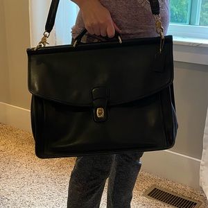 Coach black leather briefcase with Brass hardware. Used.